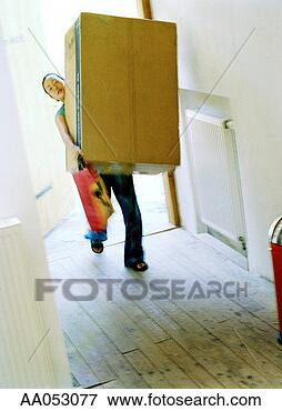 Picture - young woman carrying 
bag and large 
box into new home. 
fotosearch - search 
stock photos, 
pictures, images, 
and photo clipart