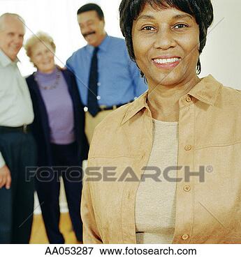 Picture - group of mature 
adults, portrait 
(focus on woman 
in foreground). 
fotosearch - search 
stock photos, 
pictures, images, 
and photo clipart