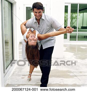 Stock Photography - man dipping woman 
while dancing 
on patio. fotosearch 
- search stock 
photos, pictures, 
images, and photo 
clipart