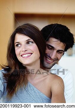 Stock Photography - man embracing 
woman, close-up. 
fotosearch - search 
stock photos, 
pictures, images, 
and photo clipart
