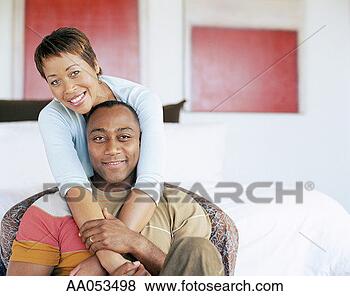 Stock Photo - woman draping 
arms over man's 
shoulders, portrait. 
fotosearch - search 
stock photos, 
pictures, images, 
and photo clipart