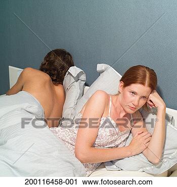 Stock Photography - young couple in 
bed turning away 
from each other. 
fotosearch - search 
stock photos, 
pictures, images, 
and photo clipart