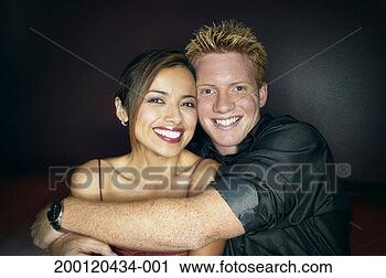Stock Photography - young couple embracing, 
portrait. fotosearch 
- search stock 
photos, pictures, 
images, and photo 
clipart
