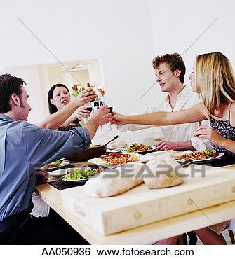 Stock Photo - two couples toasting 
wine glasses over 
dinner table. 
fotosearch - search 
stock photos, 
pictures, images, 
and photo clipart