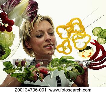 Stock Photography - woman chopping 
salad vegetables, 
low angle view. 
fotosearch - search 
stock photos, 
pictures, images, 
and photo clipart