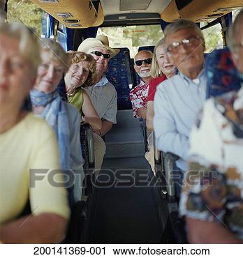 Stock Photography - mature passengers 
seated on bus, 
smiling, portrait. 
fotosearch - search 
stock photos, 
pictures, images, 
and photo clipart
