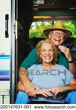Stock Photography - senior couple 
sitting in doorway 
of motor home, 
portrait. fotosearch 
- search stock 
photos, pictures, 
images, and photo 
clipart