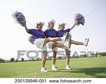 Stock Photography - three senior women 
in cheerleading 
uniforms kicking 
up legs. fotosearch 
- search stock 
photos, pictures, 
images, and photo 
clipart