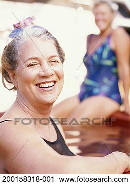 Stock Photography - two mature women 
relaxing in hot 
tub (focus on 
woman in foreground). 
fotosearch - search 
stock photos, 
pictures, images, 
and photo clipart