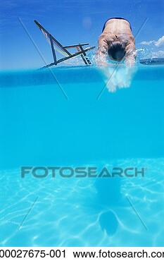Stock Photography - man diving in 
to swimming pool, 
shadow cast in 
water. fotosearch 
- search stock 
photos, pictures, 
images, and photo 
clipart