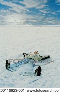 Stock Photography - girl (11-13) lying 
in snow making 
snow angel, elevated 
view. fotosearch 
- search stock 
photos, pictures, 
images, and photo 
clipart