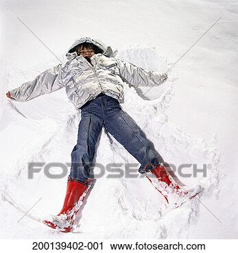 Stock Photography - girl (5-7) making 
snow angel, elevated 
view. fotosearch 
- search stock 
photos, pictures, 
images, and photo 
clipart