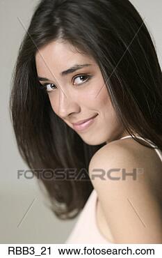 Stock Photography - close up portrait 
of a young ethnic 
woman as she turns 
and smiles. fotosearch 
- search stock 
photos, pictures, 
images, and photo 
clipart