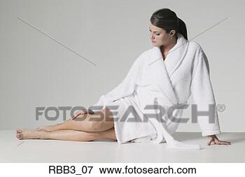 Picture - full body portrait 
of a young brunette 
caucasian woman 
in a bathrobe. 
fotosearch - search 
stock photos, 
pictures, images, 
and photo clipart