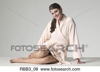 Stock Photo - full body portrait 
of a young brunette 
woman in a bathrobe. 
fotosearch - search 
stock photos, 
pictures, images, 
and photo clipart