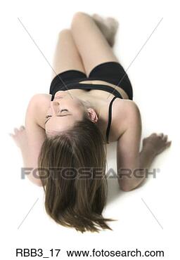 Picture - full body portrait 
of a young woman 
in a black workout 
outfit as she. 
fotosearch - search 
stock photos, 
pictures, images, 
and photo clipart