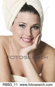 Stock Photography - head and shoulders 
portrait of a 
young woman with 
her head wrapped 
in. fotosearch 
- search stock 
photos, pictures, 
images, and photo 
clipart
