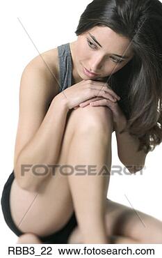 Stock Photo - medium shot of 
a young woman 
in a workout outfit 
as she rests on 
her. fotosearch 
- search stock 
photos, pictures, 
images, and photo 
clipart