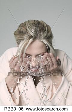 Stock Photo - a young blonde 
caucasian woman 
splashes her face 
with water. fotosearch 
- search stock 
photos, pictures, 
images, and photo 
clipart