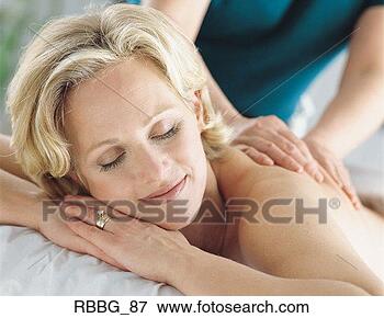 Picture - beautiful older 
blonde married 
woman getting 
a massage by a 
masseuse. fotosearch 
- search stock 
photos, pictures, 
images, and photo 
clipart