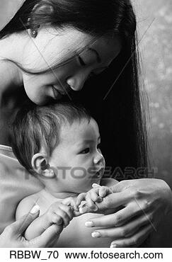 Stock Photography - an asian american 
mother and child 
engage in a peaceful 
moment. fotosearch 
- search stock 
photos, pictures, 
images, and photo 
clipart