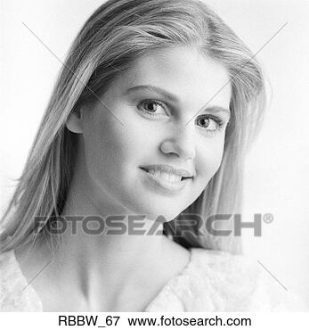 Picture - a blonde young 
woman wears a 
coy smile. fotosearch 
- search stock 
photos, pictures, 
images, and photo 
clipart