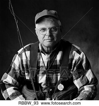 Stock Photo - a caucasian elderly 
man sits in his 
fly fishing gear. 
fotosearch - search 
stock photos, 
pictures, images, 
and photo clipart