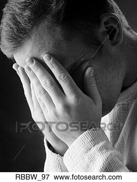 Picture - a caucasian man 
holds his face 
in his hands. 
fotosearch - search 
stock photos, 
pictures, images, 
and photo clipart