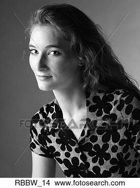 Stock Photo - a caucasian young 
woman in a flowered 
shirt sits side 
profile. fotosearch 
- search stock 
photos, pictures, 
images, and photo 
clipart