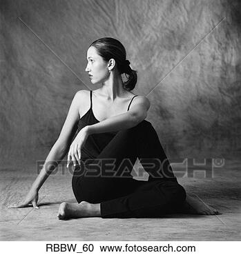 Stock Photography - a dark haired 
dancer sits in 
an elegant pose 
on the floor. 
fotosearch - search 
stock photos, 
pictures, images, 
and photo clipart