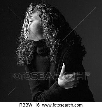 Stock Photo - a side profile 
of a young caucasian 
woman whose face 
is obscured my. 
fotosearch - search 
stock photos, 
pictures, images, 
and photo clipart