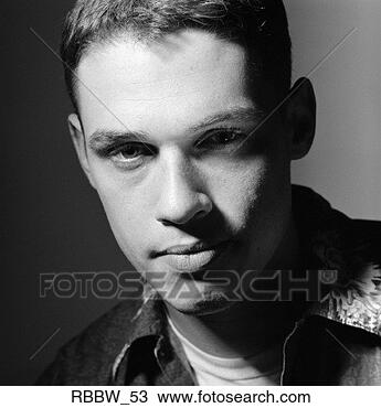 Stock Photo - a tough caucasian 
male stares with 
a slight smirk. 
fotosearch - search 
stock photos, 
pictures, images, 
and photo clipart