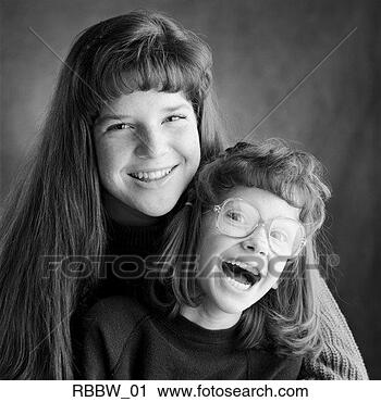 Stock Photography - two young caucasian 
sisters laugh 
together. fotosearch 
- search stock 
photos, pictures, 
images, and photo 
clipart