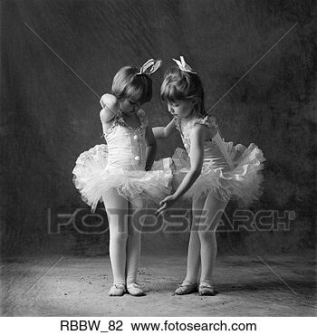 Stock Photo - two young caucasian 
ballerinas primp 
and get ready 
to dance. fotosearch 
- search stock 
photos, pictures, 
images, and photo 
clipart