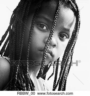 Stock Photography - a young african 
american girl 
peers through 
her braids with 
a look of. fotosearch 
- search stock 
photos, pictures, 
images, and photo 
clipart