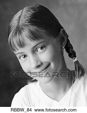 Stock Photo - a young caucasian 
girl in braids 
shyly smiles at 
the camera. fotosearch 
- search stock 
photos, pictures, 
images, and photo 
clipart