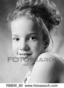 Stock Photography - a young redheaded 
girl smiles over 
her shoulder. 
fotosearch - search 
stock photos, 
pictures, images, 
and photo clipart