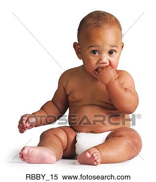 Stock Image - an african american 
baby sits in a 
diaper and puts 
his hand in his. 
fotosearch - search 
stock photos, 
pictures, images, 
and photo clipart