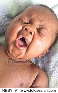 Stock Photo - an african american 
baby lies on its 
back and yawns. 
fotosearch - search 
stock photos, 
pictures, images, 
and photo clipart