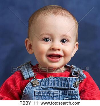 Stock Photography - a caucasian baby 
in overalls happily 
smiles. fotosearch 
- search stock 
photos, pictures, 
images, and photo 
clipart