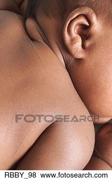 Stock Photo - extreme close 
up of an african 
american baby 
back as it lies 
on its. fotosearch 
- search stock 
photos, pictures, 
images, and photo 
clipart