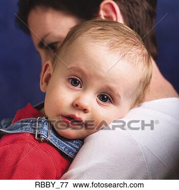Picture - a sad caucasian 
baby is consoled 
by its mother. 
fotosearch - search 
stock photos, 
pictures, images, 
and photo clipart