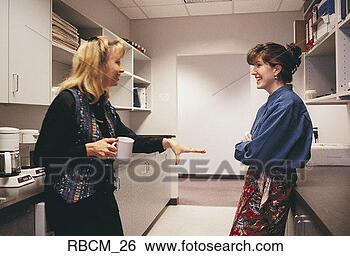 Stock Photo - a woman dressed 
in a black shirt 
addresses another 
dressed in a blue. 
fotosearch - search 
stock photos, 
pictures, images, 
and photo clipart