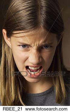 Stock Photography - a caucasian preteen 
girl with long 
brown hair is 
scowling as she 
tips. fotosearch 
- search stock 
photos, pictures, 
images, and photo 
clipart