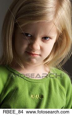 Stock Photo - a little blond 
girl in a green 
shirt scrunches 
her nose in an. 
fotosearch - search 
stock photos, 
pictures, images, 
and photo clipart
