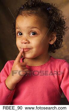 Stock Photography - a pretty little 
african american 
girl wearing a 
pink shirt is 
looking. fotosearch 
- search stock 
photos, pictures, 
images, and photo 
clipart