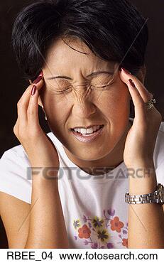 Stock Photo - a young asian 
woman with short 
hair holds her 
fingers to her 
temples. fotosearch 
- search stock 
photos, pictures, 
images, and photo 
clipart