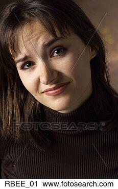 Stock Photography - a young caucasian 
brunette woman 
in a dark turtleneck 
has an. fotosearch 
- search stock 
photos, pictures, 
images, and photo 
clipart