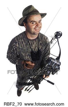 Stock Photography - an adult male 
hunter dressed 
in camouflage 
and holding his 
crossbow. fotosearch 
- search stock 
photos, pictures, 
images, and photo 
clipart