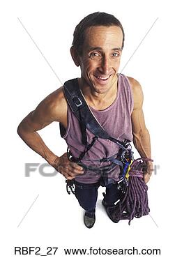Picture - an adult male 
rock climber worker 
in a purple tank 
top and climbing. 
fotosearch - search 
stock photos, 
pictures, images, 
and photo clipart